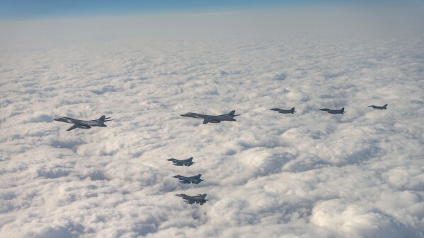 In this photo provided by South Korea Defense Ministry, U.S. Air Force B-1B bombers, F-16 fighter jets, South Korean Air Force F-15K fighter jets and Japanese Air Force F-2 fighter jets fly over South Korea's southern island of Jeju during a joint air drill, Wednesday, Dec. 20, 2023. The United States flew a long-range bomber for joint drills with South Korea and Japan on Wednesday in a show of force against North Korea, days after the North performed its first intercontinental ballistic missile test in five months. (South Korea Defense Ministry via AP)