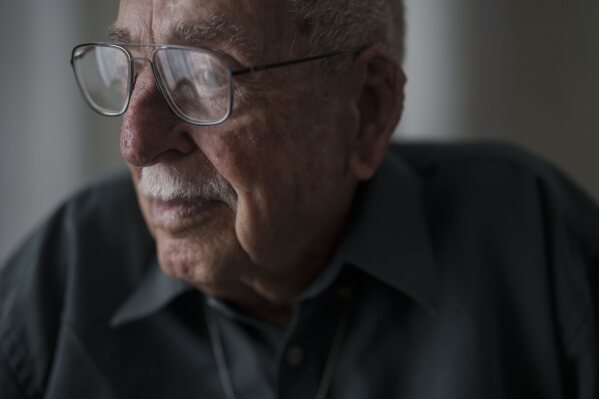 Yankale Cohen, 89, one of the founders of Kibbutz Nahal Oz, sits for a portrait in an apartment in an assisted living facility in Bat Yam, Israel, Friday, Feb. 9, 2024, where he is staying after the Oct. 7, 2023, Hamas cross-border attack in Israel. (AP Photo/Leo Correa)