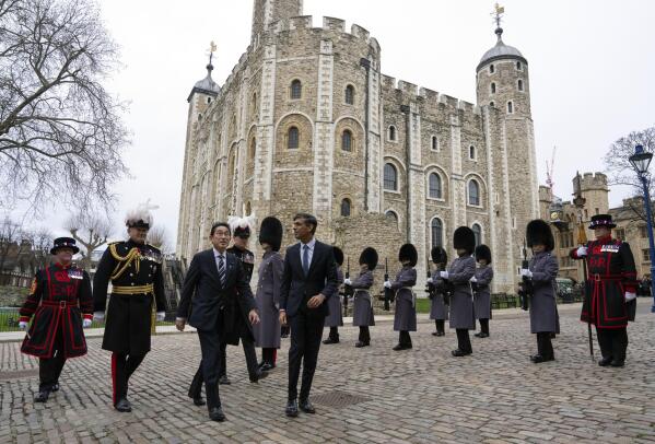 Britain's Prime Minister Rishi Sunak, center, and Japan's Prime Minister Fumio Kishida, next to him, arrive at the Tower of London, Wednesday, Jan. 11, 2023. The leaders of Britain and Japan are signing a defense agreement on Wednesday that could see troops deployed to each others’ countries. (Carl Court/Pool Photo via AP, File)