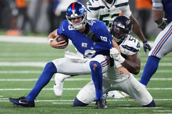 New York Giants quarterback Daniel Jones (8) is sacked by Seattle Seahawks linebacker Boye Mafe (53) during the fourth quarter of an NFL football game, Monday, Oct. 2, 2023, in East Rutherford, N.J. (AP Photo/Frank Franklin II)