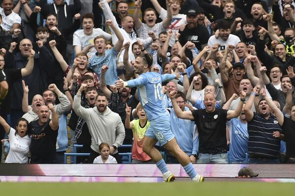 Manchester City's Jack Grealish celebrates after scoring his side's second goal during the English Premier League soccer match between Manchester City and Norwich City at Etihad stadium in Manchester, England, Saturday, Aug. 21, 2021. (AP Photo/Rui Vieira)