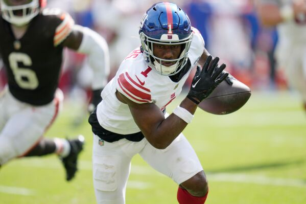 New York Giants wide receiver Malik Sabers (1) is pursued by Cleveland Browns linebacker Jeremiah Owusu-Koramoah during an NFL football game Sunday, Sept. 22, 2024, in Cleveland. (AP Photo/Sue Ogrocki, file)