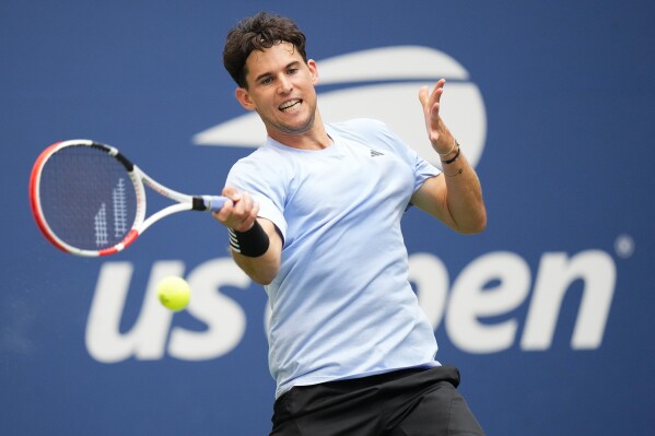 FILE - Dominic Thiem, of Austria, returns a shot to Ben Shelton, of the United States during the second round of the U.S. Open tennis championships on Aug. 30, 2023, in New York. Former U.S. Open champion Thiem had a brush with one of Australia's most venomous snakes during a qualifying match at the Brisbane International on Saturday, Dec. 30. (AP Photo/Frank Franklin II, File)