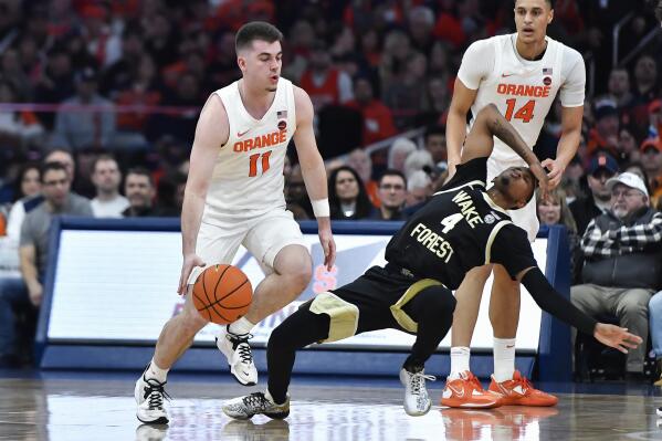 Syracuse forward Benny Williams, right, grabs a rebound in front