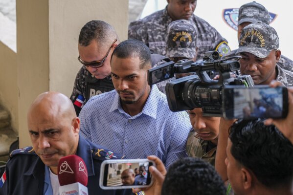 Tampa Bay Rays shortstop Wander Franco, center, is escorted by police to court in Puerto Plata, Dominican Republic Friday, Jan. 5, 2024. Dominican prosecutors on Wednesday accused Franco of commercial sexual exploitation and money laundering following allegations that he had a relationship with a minor whose mother also faces the same charges. (AP Photo/Ricardo Hernández)