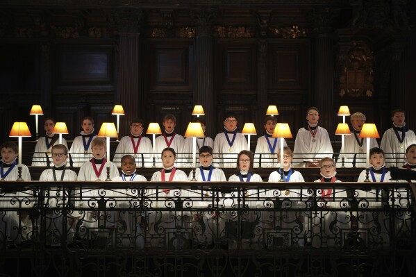 The Choristers of St Paul's choir, including girls for the first time in its 900-year history, rehearse for Christmas services in St Paul's Cathedral, in London, Monday, Dec. 23 2024. (AP Photo/Kin Cheung)