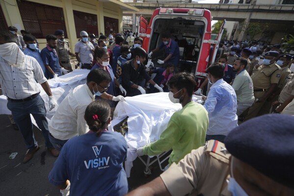 Remains of victims are brought to Civil Hospital after an airplane crashed in India's northwestern city of Ahmedabad in Gujarat state, Thursday, June 12, 2025. (AP Photo/Ajit Solanki)