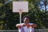 Bryant West poses for a portrait on a basketball court built by NBA star Devin Booker, who went to high school here, in Moss Point, Miss., Friday, Oct. 20, 2023. Girls consistently are outperforming boys, graduating at higher rates at public high schools around the country. Students, educators and researchers say there are several reasons why boys are falling short.(AP Photo/Gerald Herbert)
