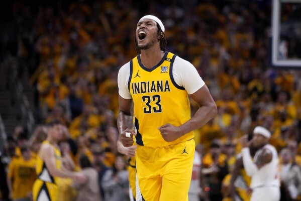 Indiana Pacers center Myles Turner celebrates at the end of Game 3 against the New York Knicks in an NBA basketball second-round playoff series, Friday, May 10, 2024, in Indianapolis. The Pacers won 111-106. (AP Photo/Michael Conroy)