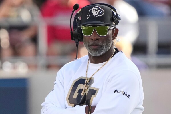 Colorado head coach Deion Sanders watches during the first half during an NCAA college football game against Arizona, Saturday, Oct. 19, 2024, in Tucson, Ariz. (AP Photo/Rick Scuteri, File)
