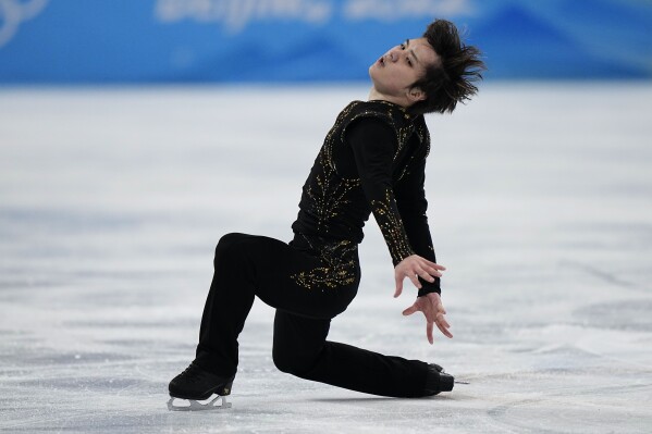 FILE - Shoma Uno, of Japan, competes in the men's free skate program during the figure skating event at the 2022 Winter Olympics, Thursday, Feb. 10, 2022, in Beijing. Two-time World champion Uno will showcase his new programs at the NHK Trophy in Osaka as he bids for a spot in figure skating’s Grand Prix Final. (AP Photo/David J. Phillip, File)