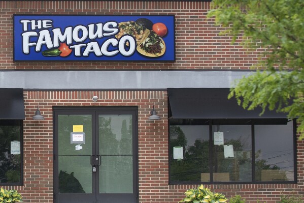 CORRECTS LOCATION: Signage hangs at Famous Taco's new location in Fort Wayne, In., Friday, May 17, 2024. An Indiana judge who declared that “tacos and burritos are Mexican-style sandwiches” has cleared the way for the opening of the restaurant's second location in Fort Wayne, delighting a restauranteur following a legal battle. (Stan Sussina/The Journal-Gazette via AP)