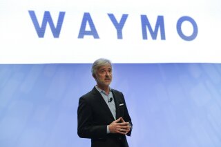 FILE - In this Sunday, Jan. 8, 2017, file photo, John Krafcik, CEO of Waymo, the autonomous vehicle company created by Google's parent company, Alphabet speaks at the North American International Auto Show in Detroit. The executive who steered the transformation of Google’s self-driving car project into a separate company worth billions of dollars is stepping down after more than five years on the job. Krafcik announced his departure as CEO of Waymo, a company spun out from Google, in a Friday, April 2, 2021, blog post that cited his desire to enjoy life as the world emerges from the pandemic. (AP Photo/Paul Sancya, File)
