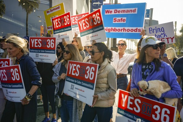 Neighbors and business owners join to support California's Proposition 36 on the November ballot at a news conference in the Venice neighborhood of Los Angeles on Monday, Sept. 30, 2024. (AP Photo/Damian Dovarganes)
