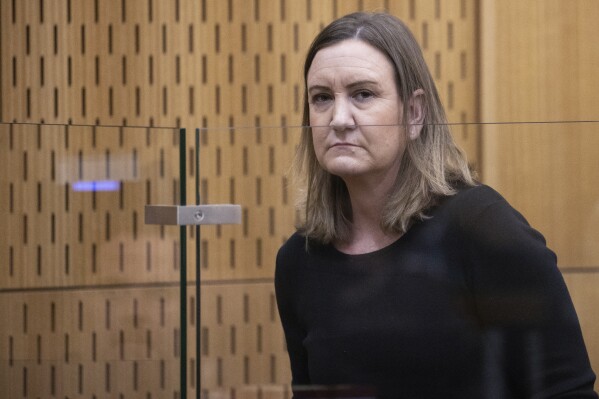 Lauren Dickason stands in the dock at the Christchurch High Court, in Christchurch, New Zealand, on July, 17, 2023. A New Zealand jury on Wednesday, Aug. 16, found Dickason, a mother guilty of murdering her three young daughters in a case that shocked the nation. (George Heard/New Zealand Herald via AP)