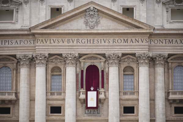 Pope Leo XIV appears at the central balcony of St. Peter's Basilica for his first Sunday blessing after his election, in St. Peter's Square at the Vatican, Sunday, May 11, 2025.(AP Photo/Andrew Medichini)