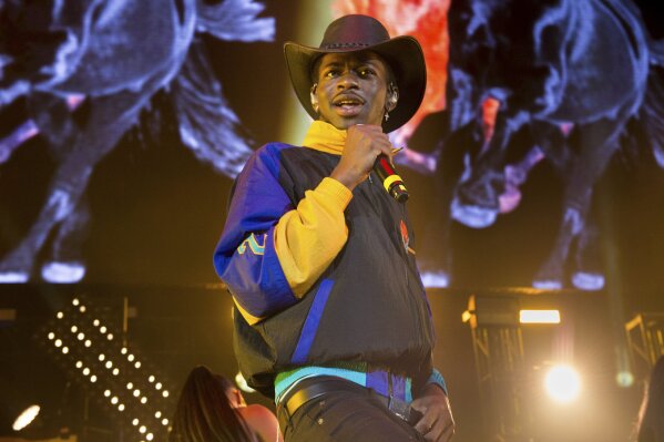 FILE - This June 1, 2019 file photo shows Lil Nas X performing at HOT 97 Summer Jam 2019 in East Rutherford, N.J. The rapper has taken his "Old Town Road" to the top of the Billboard charts for 16 weeks, tying a record set by Mariah Carey and Luis Fonsi. (Photo by Scott Roth/Invision/AP, File)