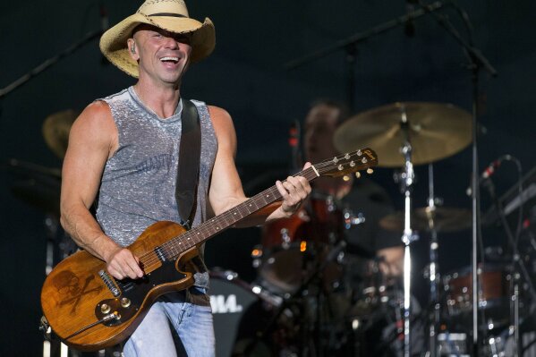 FILE - In this April 3, 2016, file photo, Kenny Chesney performs at the 4th Annual ACM Party for a Cause Festival in Las Vegas. Chesney’s No Shoes Reefs organization is helping to have an artificial reef installed off of Florida’s Atlantic Coast. The organization and other marine groups donated and installed 13 reef balls on the ocean floor off of Delray Beach in Palm Beach County. (Photo by Eric Jamison/Invision/AP, File)