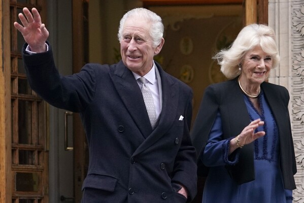 FILE - Britain's King Charles III and Queen Camilla leave The London Clinic in central London, Monday, Jan. 29, 2024. King Charles III was in hospital to receive treatment for an enlarged prostate. Buckingham Palace officials say King Charles III and Queen Camilla will attend an Easter service at the chapel at Windsor Castle on Sunday, March 30, 2024. The appearance will be the first major event for Charles, 75, since he was diagnosed with cancer in February. (AP Photo/Alberto Pezzali, File)