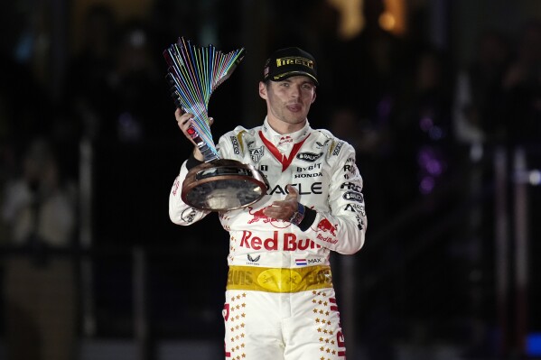 Red Bull driver Max Verstappen, of the Netherlands, holds a trophy after winning the Formula One Las Vegas Grand Prix auto race, Sunday, Nov. 19, 2023, in Las Vegas. (AP Photo/Nick Didlick)
