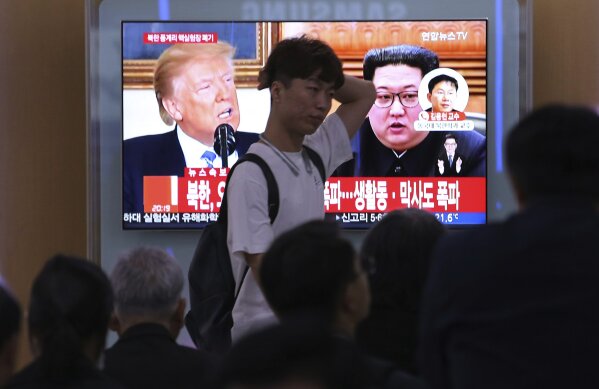 
              People watch a TV screen showing file footage of U.S. President Donald Trump, left, and North Korean leader Kim Jong Un during a news program at the Seoul Railway Station in Seoul, South Korea, Thursday, May 24, 2018. North Korea carried out what it said is the demolition of its nuclear test site Thursday, setting off a series of explosions over several hours in the presence of foreign journalists.The signs read: " North Korea demolishes nuclear test site ." (AP Photo/Ahn Young-joon)
            