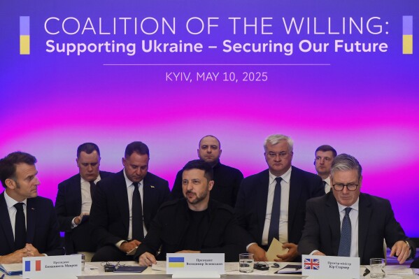 France's President Emmanuel Macron, left, Ukrainian President Volodymyr Zelenskyy and British Prime Minister Keir Starmer, right, sit during a summit at the Mariinskyi Palace, in Kyiv, Ukraine, Saturday, May 10, 2025. (Ludovic Marin, Pool Photo via AP)