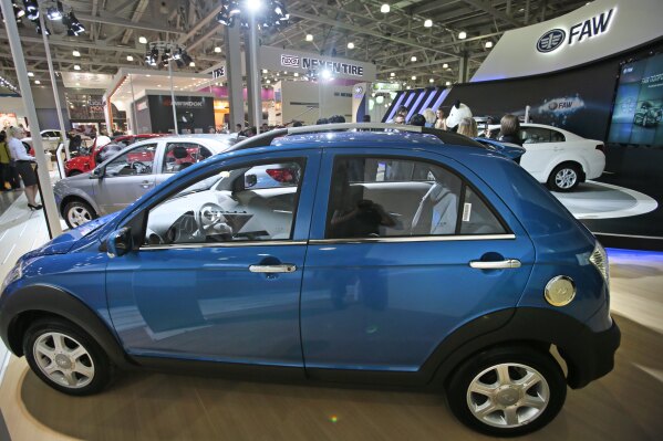 FILE - Chinese FAW V2 car is displayed at the Moscow International Automobile Salon in Moscow, Russia, Friday, Aug. 31, 2012. The divide between China and Europe over the war in Ukraine was on display this week. As a Chinese envoy crisscrossed Europe for talks on ending the war, the Chinese foreign minster trumpeted the export of Chinese cars to Russia and Russian natural gas to China. The sharp rise in China-Russia trade is something the West sees as undermining its sanctions on Russia. (AP Photo/Mikhail Metzel, File)