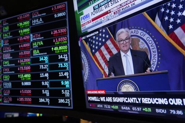 FILE - Federal Reserve chairman Jerome Powell appears on a monitor on the floor of the New York Stock Exchange in New York, Wednesday, Nov. 2, 2022. The Federal Reserve is poised this week to raise its benchmark interest rate for an eighth time since March. (AP Photo/Seth Wenig, File)