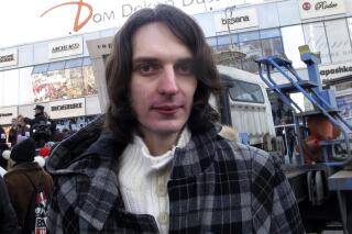 FILE - Opposition activist Maxim Kats speaks to journalists at an opposition rally in Moscow, March 10, 2012. A Russian court on Thursday March 23, 2023, issued an arrest warrant for Maxim Kats on charges of disparaging the military, and the authorities declared other activists and bloggers “foreign agents” amid efforts to muzzle criticism of Russia's action in Ukraine. (AP Photo/Maria Danilova, File)