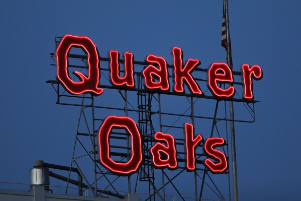 FILE - The Quaker Oats sign is seen in Cedar Rapids, Iowa on Tuesday, June 8, 2021. The Quaker Oats Company has expanded a December recall of more than 40 products that may be contaminated with salmonella to include two dozen additional types of granola bars, cereals and snack foods, Friday, Jan. 12, 2023. (Rebecca F. Miller/The Gazette via AP, File)