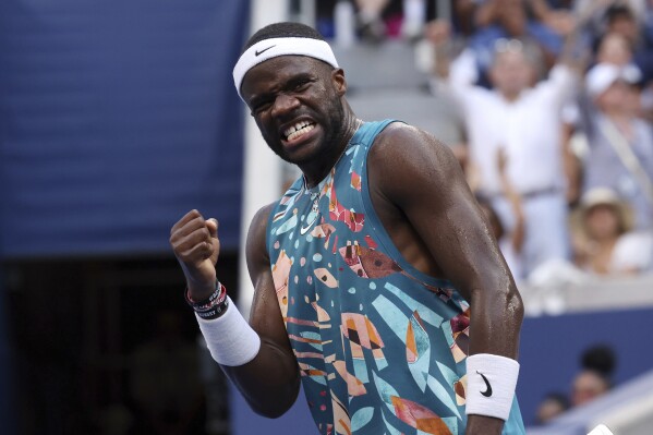 Frances Tiafoe celebrates as he plays Rinky Hijikata, of Australia, during the fourth round of the U.S. Open tennis championships, Sunday, Sept. 3, 2023, in New York. (AP Photo/Jason DeCrow)