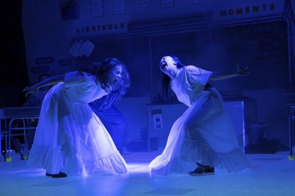 This image released by O&M/DKC shows Sadie Sink, left, and Amalia Yoo during a performance of "John Proctor Is the Villain" in New York. (Julieta Cervantes/O&M/DKC via AP)