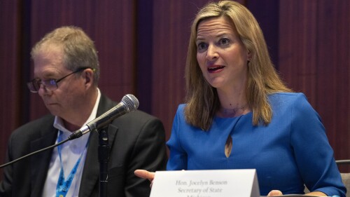 Jocelyn Benson, Michigan's Secretary of State, right, attends a panel about elections during the summer meeting of the National Association of Secretaries of State, Tuesday, July 11, 2023, in Washington. Efforts to deceive the public about voting and elections remain a top concern for state election officials as they dig into preparations for the 2024 election. (AP Photo/Jacquelyn Martin)