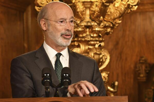 Pennsylvania Gov. Tom Wolf speaks to reporters during a news conference on his signing an executive order for his administration to start working on regulations to bring Pennsylvania into a nine-state consortium that sets a price and limits on greenhouse gas emissions from power plants, Thursday, Oct. 3, 2019 in Harrisburg, Pa. The move is part of Wolf's effort to fight climate change in the nation's fourth-biggest emitter of greenhouse gases. (AP Photo/Marc Levy)