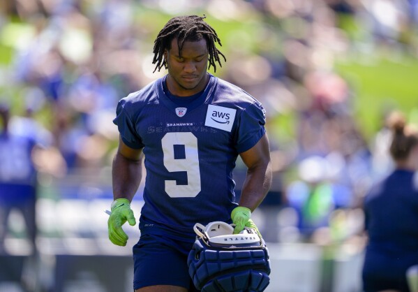 Rookie Devon Witherspoon unsigned and absent from start of Seahawks camp