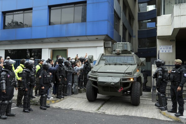 A military vehicle transports Ecuador's former vice president Jorge Glass from the detention center where he was held after police stormed the Mexican embassy to arrest him in Quito, Ecuador, Saturday, April 6, 2024. Glass, who served as vice president of Ecuador between 2013 and 2018 was convicted of corruption and has been hiding in the embassy since December.  (AP Photo/Dolores Ochoa).