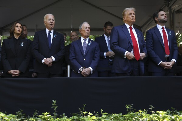 From left, Democratic presidential nominee Vice President Kamala Harris, President Joe Biden, Michael Bloomberg, Republican presidential nominee former President Donald Trump and Republican vice presidential nominee Sen. JD Vance, R-Ohio, attend the 9/11 Memorial ceremony on the 23rd anniversary of the Sept. 11, 2001 terror attacks, Wednesday, Sept. 11, 2024, in New York. (AP Photo/Yuki Iwamura)