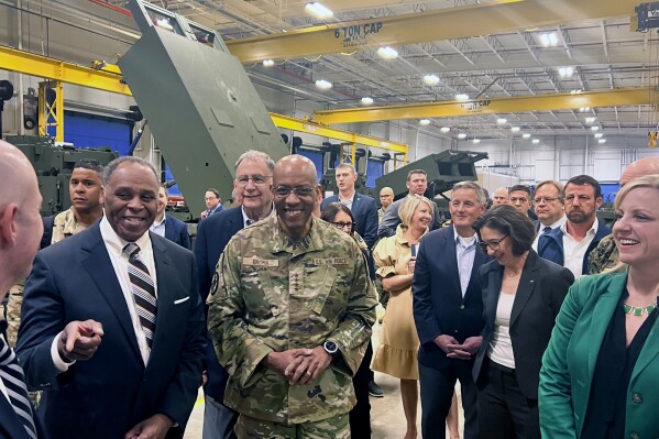 CORRECTS SPELLING TO BOOZMAN - Joint Chiefs Chairman Gen. CQ Brown, center, tours the HIMARS production line at Lockheed Martin's Camden, Ark. facility Thursday, March 14, 2024, with Sen. John Boozman, R-Ark., left. (AP Photo/Tara Copp)