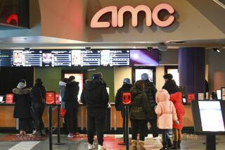 FILE - In this March 5, 2021 file photo, people line up for movie tickets at a reopened AMC theater in New York.  AMC said Wednesday, June 2,  that it’s launching AMC Investor Connect, an initiative that will put the company in direct communication with its individual shareholders to keep them up to date about important company information and provide them with special offers.   (Photo by Evan Agostini/Invision/AP, File)