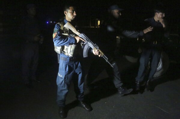 Afghan police arrive at the site of a bombing in a mosque in Kabul, Afghanistan, Tuesday, June 2, 2020. Tariq Arian, spokesman for the Afghan interior ministry says the the attack has taken place inside the compound of Wazir Akber Khan Mosque on the Tuesday evening. (AP Photo/Rahmat Gul)
