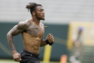 New York Jets' Bless Austin warms up before a preseason NFL football game against the Green Bay Packers Saturday, Aug. 21, 2021, in Green Bay, Wis. (AP Photo/Matt Ludtke)