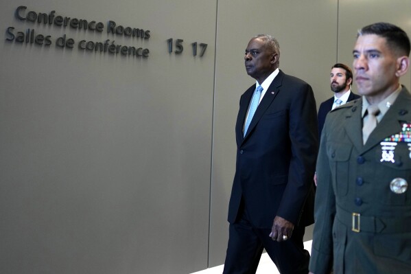 United States Secretary of Defense Lloyd Austin, left, arrives for a bilateral meeting on the sidelines of a NATO defense ministers meeting at NATO headquarters in Brussels, Thursday, June 13, 2024. NATO defense ministers gathered Thursday hoping to agree on a new plan to provide long-term security assistance and military training to Ukraine, after Hungary promised not to veto the scheme as long as it's not forced to take part. (AP Photo/Virginia Mayo, Pool)