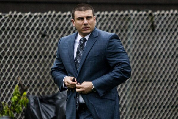 FILE - In this May 13, 2019, file photo New York City police officer Daniel Pantaleo leaves his house in Staten Island, N.Y. Pantaleo, the New York City officer who put Eric Garner in a deadly chokehold, had eight misconduct complaints against him. (AP Photo/Eduardo Munoz Alvarez, File)