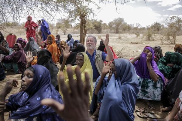 World Food Program chief David Beasley meets with villagers in the village of Wagalla in northern Kenya Friday, Aug. 19, 2022. The United States is stepping up to buy about 150,000 metric tons of grain from Ukraine in the next few weeks for an upcoming shipment of food aid from ports no longer blockaded by war, the World Food Program chief has told The Associated Press. (AP Photo/Brian Inganga)