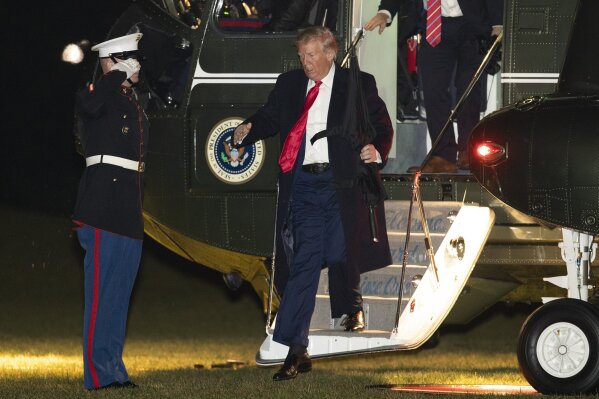 President Donald Trump disembarks Marine One helicopter upon arrival at the White House Tuesday, Dec. 10, 2019, in Washington, from a campaign rally in Hershey, Pa. (AP Photo/Manuel Balce Ceneta)
