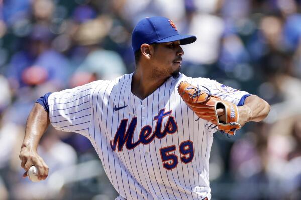 New York Mets pitcher Carlos Carrasco throws during the first inning of a baseball game against the Texas Rangers on Sunday, July 3, 2022, in New York. (AP Photo/Adam Hunger)