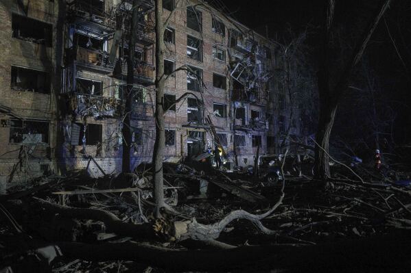 Rescue workers clear the rubble at a house damaged by a Russian airstrike in a residential neighborhood in Kyiv, Ukraine, on Thursday, April 24, 2025. (AP Photo/Evgeniy Maloletka)