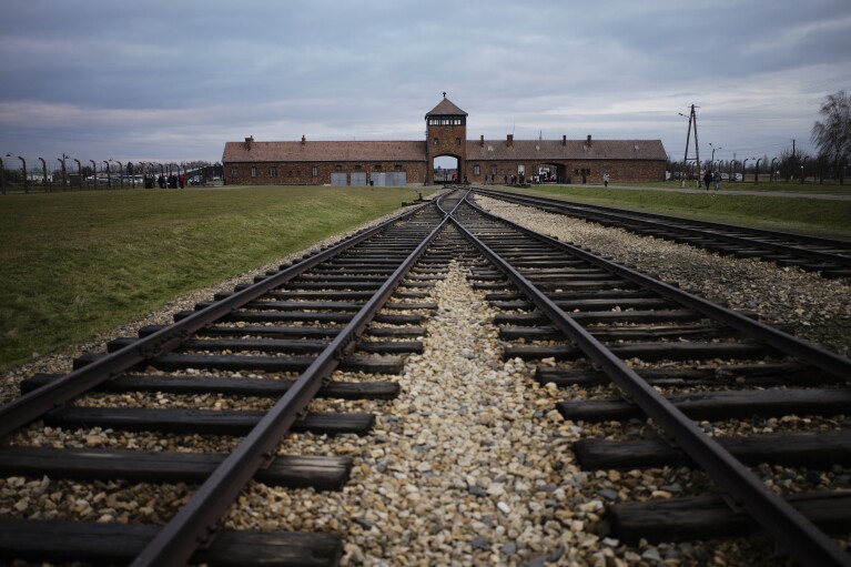 The railway tracks where hundred thousands of people arrived to be directed to the gas chambers inside the former Nazi death camp of Auschwitz Birkenau, or Auschwitz II, are pictured in Oswiecim, Poland, on Dec. 7, 2019. (AP Photo/Markus Schreiber)