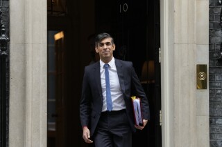 Britain's Prime Minister Rishi Sunak leaves 10 Downing Street for his weekly Prime Ministers Questions at the House of Commons in London, Wednesday, Nov. 22, 2023. (AP Photo/Frank Augstein)