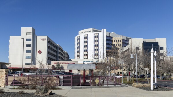Saint Alphonsus Regional Medical Center in Boise, Idaho, is shown on Wednesday, March 20, 2024. Three Idaho corrections officers were shot as a suspect staged a brazen attack to break Skylar Meade, a prison inmate out of the Boise hospital overnight. Two of the officers were shot by the suspect early Wednesday. The third was shot and wounded by a police officer when police mistook the correctional officer for the suspect. (Sarah A. Miller/Idaho Statesman via AP)